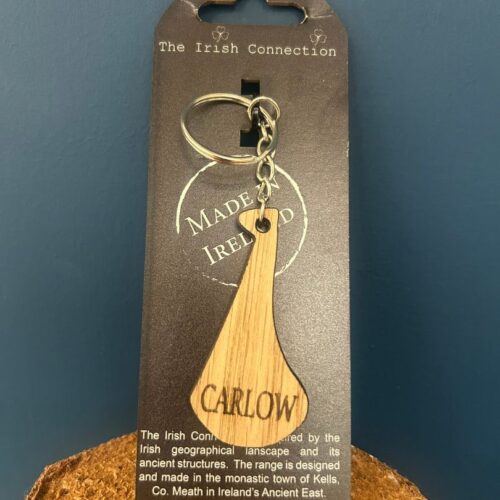 Handcrafted wooden hurley keychain engraved with Carlow for Carlow GAA & Camogie club on a black backing card