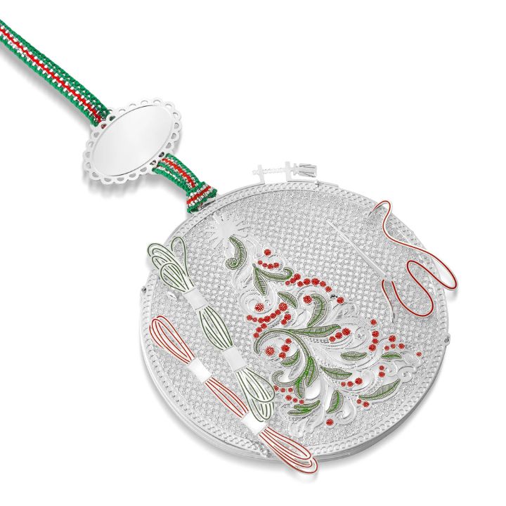 • Silver-plated embroidery hoop Christmas tree ornament by Newbridge Silverware featuring green and red enamel detail hanging on a festive ribbon.