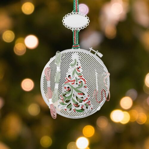 • Silver-plated embroidery hoop Christmas tree ornament by Newbridge Silverware featuring green and red enamel detail hanging on a festive ribbon.