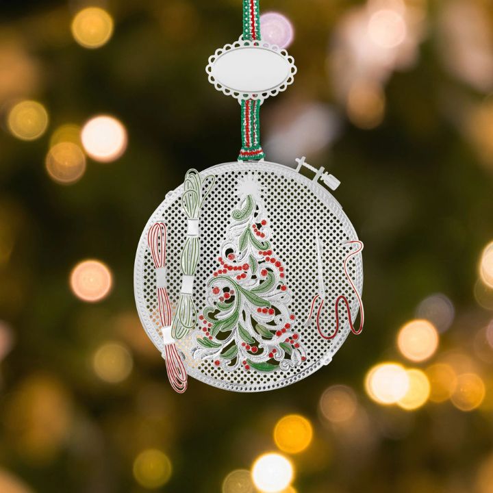 • Silver-plated embroidery hoop Christmas tree ornament by Newbridge Silverware featuring green and red enamel detail hanging on a festive ribbon.